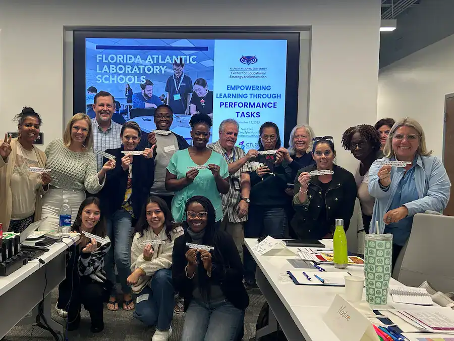 Diverse group of professionals participating in educational workshop at FL Atlantic University, focused on innovative learning strategies.