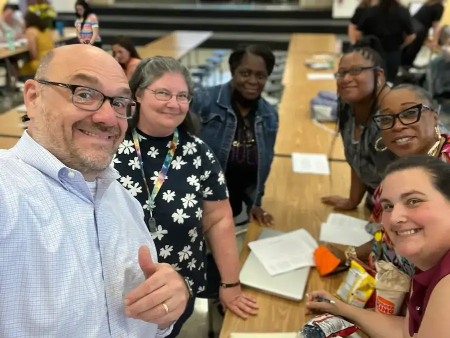 Diverse team collaborating at a workshop promoting business growth and innovation.