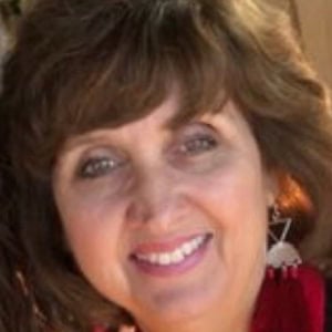 Professional woman smiling, business expert, corporate headshot for CTLG consulting services.